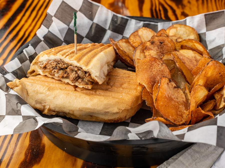 Steak bomb sandwich with chips