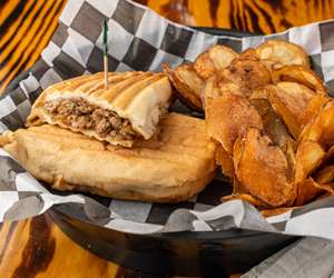 Steak bomb sandwich with chips